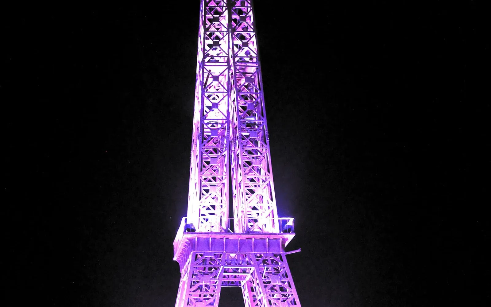 Illuminated Eiffel Tower replica at Seven Wonders Park in Kota at night